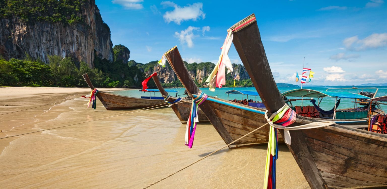 Long tail boats on beach, Thailand Thailand travel guide